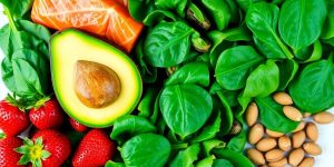 Heart-healthy foods: vibrant fruits, vegetables, nuts, fish.